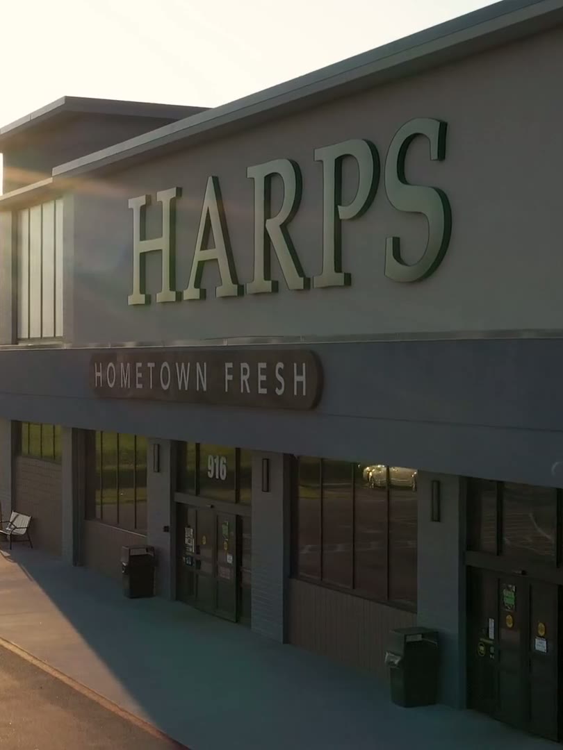 Harps storefront at golden hour